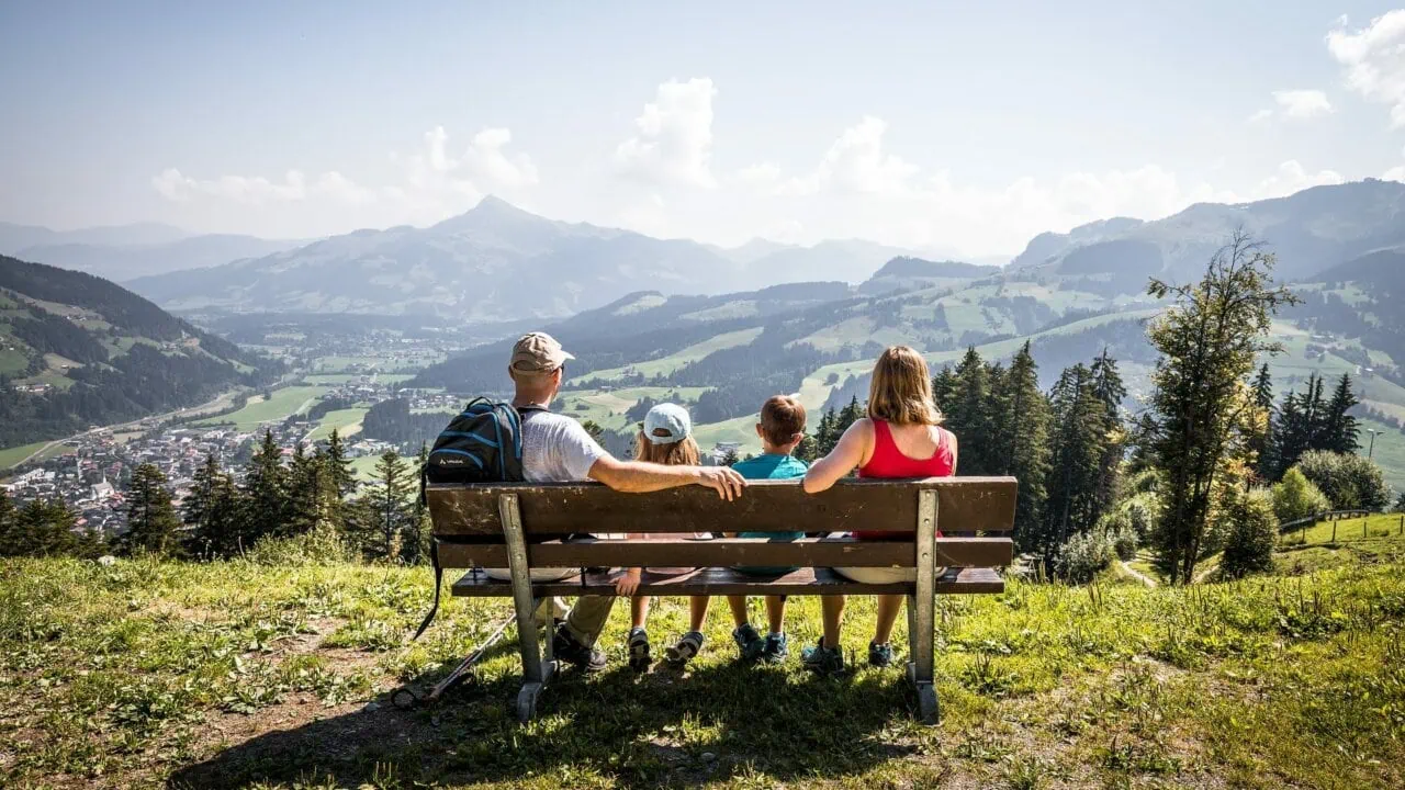 Family enjoying a mountain view together.